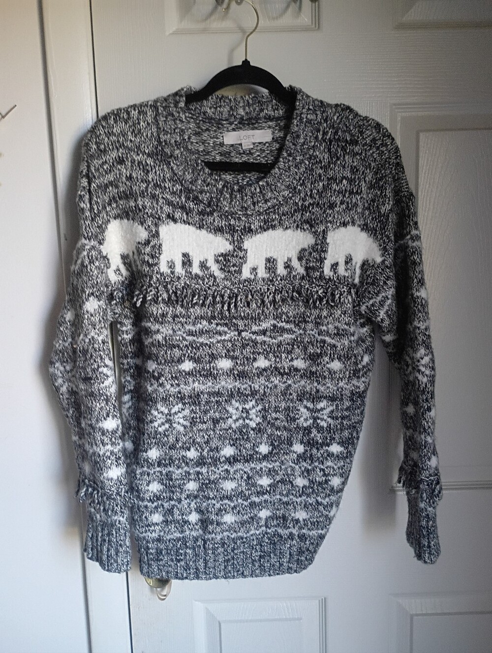 This is a LOFT black and white marled polar bear crewneck sweater
